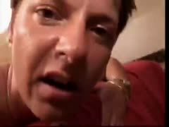 On video, a mature redhead harlot sucks prick POV style.